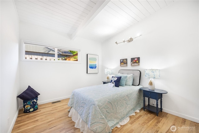 639 130th Ave NE, Bellevue, WA 98005 - bedroom with wood finished floors, baseboards, and wooden ceiling with exposed beams
