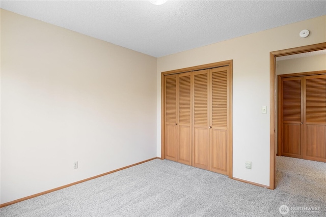 2207 Burcham St, Kelso, WA 98626 - unfurnished bedroom with carpet floors, a closet, baseboards, and a textured ceiling