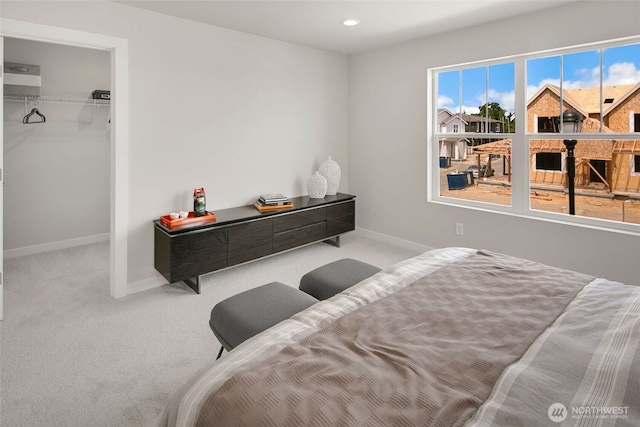 563 SW 97th St Unit 76, Seattle, WA 98106 - carpeted bedroom featuring baseboards, a walk in closet, and recessed lighting