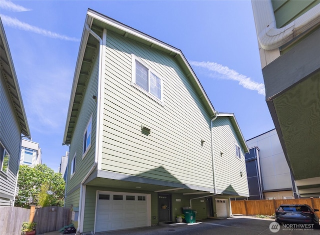 1738 NW 59th St Unit A, Seattle, WA 98107 - view of home's exterior featuring a garage