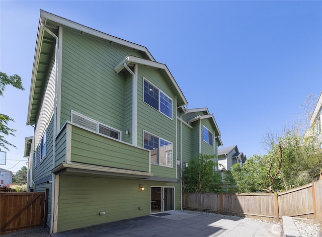 1738 NW 59th St Unit A, Seattle, WA 98107 - back of property featuring a patio and a balcony