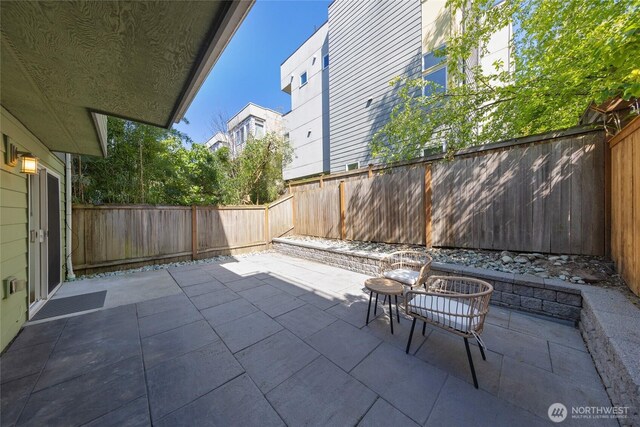 1738 NW 59th St Unit A, Seattle, WA 98107 - fenced backyard featuring a patio