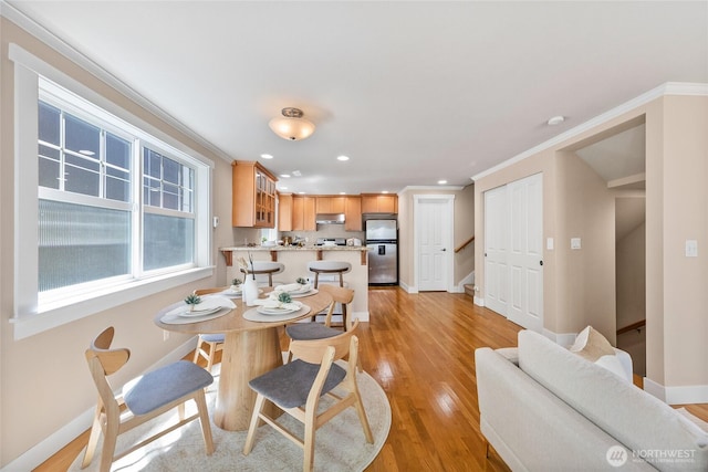 1738 NW 59th St Unit A, Seattle, WA 98107 - dining room with baseboards, light wood-type flooring, recessed lighting, stairs, and crown molding