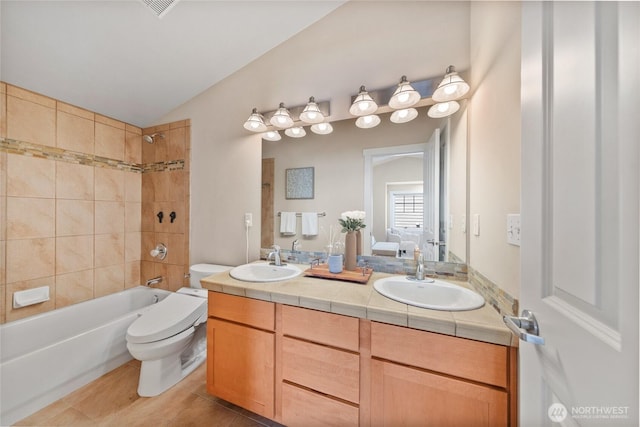 1738 NW 59th St Unit A, Seattle, WA 98107 - full bathroom with double vanity, toilet, bathing tub / shower combination, and tile patterned floors