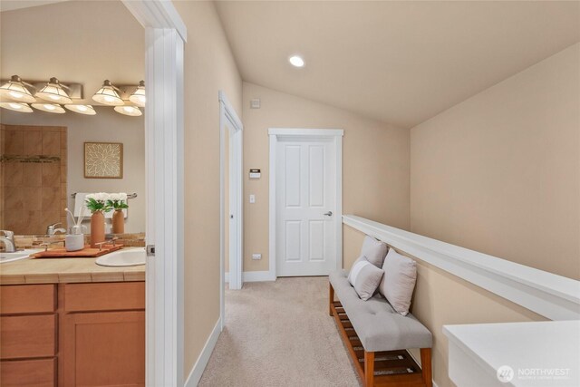 1738 NW 59th St Unit A, Seattle, WA 98107 - corridor with light colored carpet, a sink, baseboards, vaulted ceiling, and recessed lighting