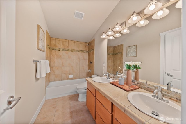 1738 NW 59th St Unit A, Seattle, WA 98107 - bathroom featuring toilet, double vanity, bathing tub / shower combination, tile patterned floors, and baseboards
