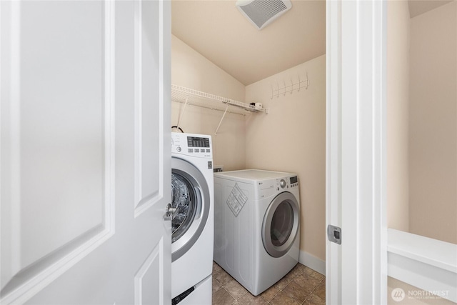 1738 NW 59th St Unit A, Seattle, WA 98107 - washroom with washing machine and clothes dryer and baseboards