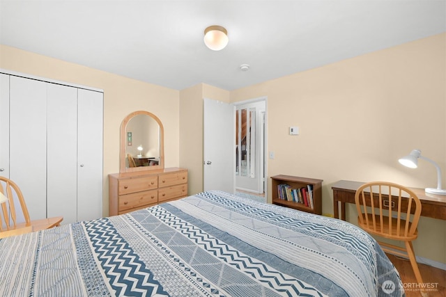 7530 Birch Bay Dr Unit 210, Blaine, WA 98230 - bedroom featuring wood finished floors, a closet, and baseboards