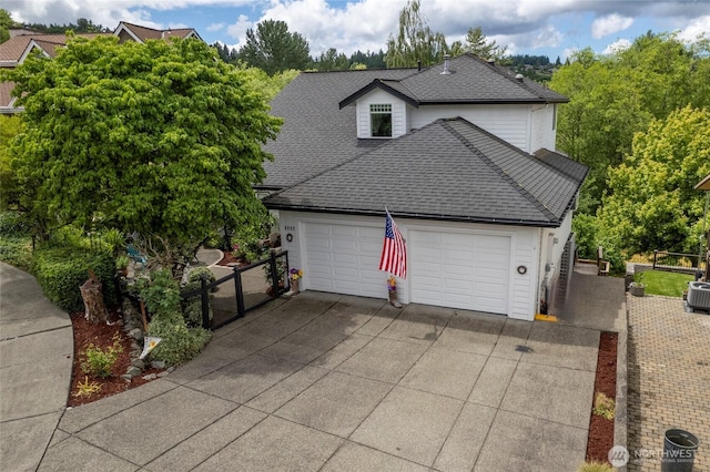 1308 11th Street Pl SW, Puyallup, WA 98371 - view of front of property with a shingled roof, concrete driveway, and a garage