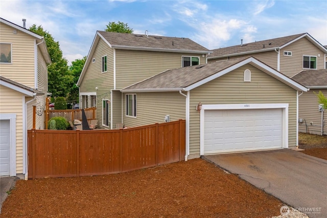4301 Mckinley St NE, Lacey, WA 98516 - view of front of house featuring driveway, a shingled roof, and an attached garage