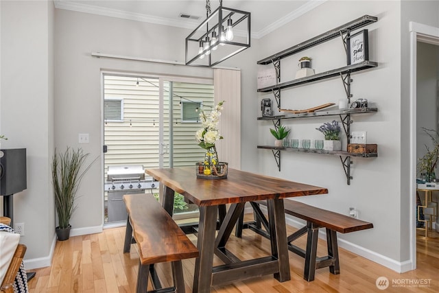 4301 Mckinley St NE, Lacey, WA 98516 - dining space with crown molding, light wood-style floors, and a chandelier