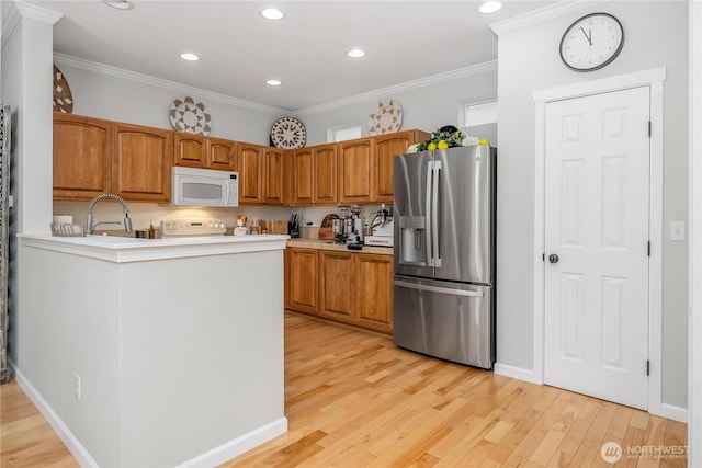 4301 Mckinley St NE, Lacey, WA 98516 - kitchen featuring stainless steel refrigerator with ice dispenser, white microwave, light wood-type flooring, crown molding, and recessed lighting
