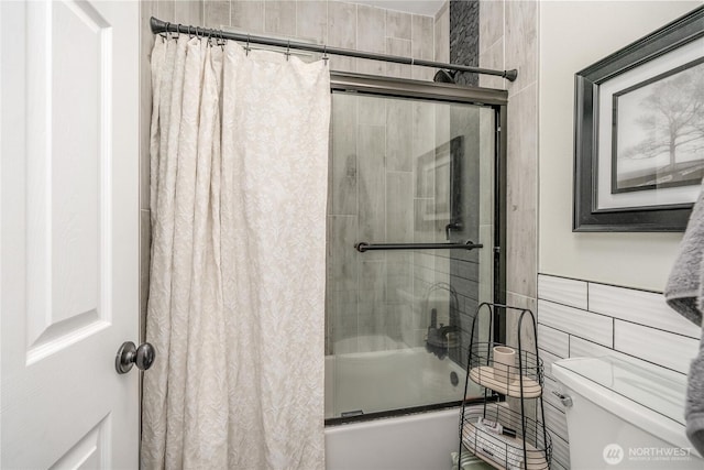 4301 Mckinley St NE, Lacey, WA 98516 - bathroom featuring combined bath / shower with glass door and tile walls