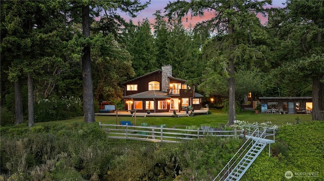 2548 S Camano Dr, Camano Island, WA 98282 - rear view of property featuring a chimney, an outdoor structure, a balcony, and a forest view