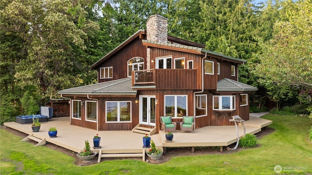 2548 S Camano Dr, Camano Island, WA 98282 - rear view of property featuring a balcony, french doors, a chimney, and a lawn