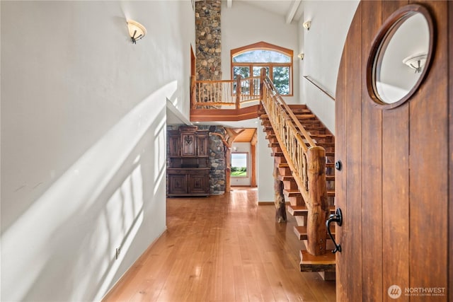 2548 S Camano Dr, Camano Island, WA 98282 - foyer entrance featuring high vaulted ceiling, stairs, and light wood finished floors
