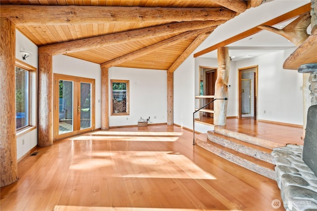 2548 S Camano Dr, Camano Island, WA 98282 - unfurnished living room with wooden ceiling, wood-type flooring, french doors, stairway, and baseboards