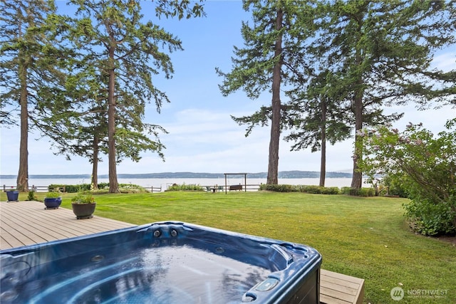 2548 S Camano Dr, Camano Island, WA 98282 - view of grassy yard with a hot tub and a deck with water view