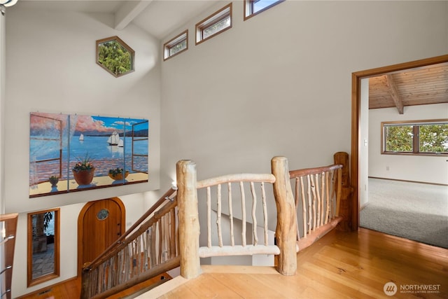 2548 S Camano Dr, Camano Island, WA 98282 - stairway with beamed ceiling, wood finished floors, and high vaulted ceiling