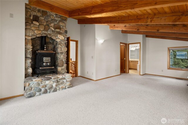 2548 S Camano Dr, Camano Island, WA 98282 - unfurnished living room featuring carpet floors, baseboards, and wood ceiling with exposed beams