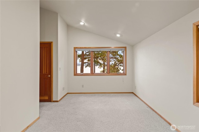 2548 S Camano Dr, Camano Island, WA 98282 - empty room featuring light colored carpet, vaulted ceiling, baseboards, and recessed lighting