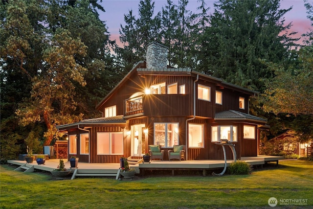 2548 S Camano Dr, Camano Island, WA 98282 - rear view of house with a chimney, a yard, a balcony, and a wooden deck