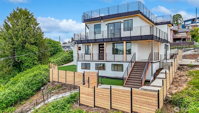 7253 S Taft St, Seattle, WA 98178 - back of property featuring a balcony and a fenced backyard