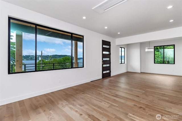 7253 S Taft St, Seattle, WA 98178 - spare room with wood finished floors, baseboards, and recessed lighting