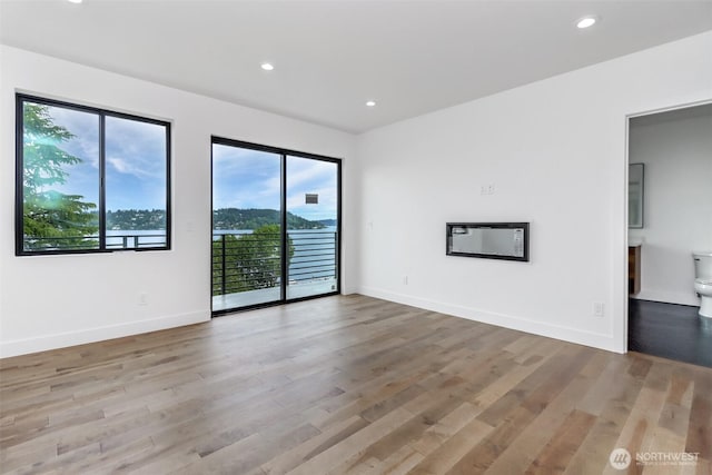 7253 S Taft St, Seattle, WA 98178 - unfurnished room featuring plenty of natural light, wood finished floors, recessed lighting, and baseboards