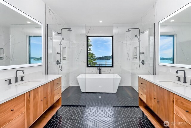 7253 S Taft St, Seattle, WA 98178 - bathroom with two vanities, a marble finish shower, a freestanding bath, and recessed lighting