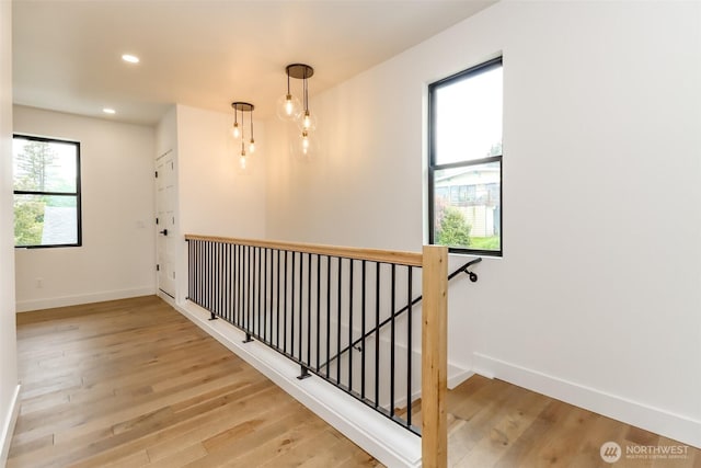 7253 S Taft St, Seattle, WA 98178 - corridor featuring baseboards, an upstairs landing, wood finished floors, and recessed lighting