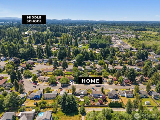 4404 29th Ave SE, Lacey, WA 98503 - aerial view of residential area with a heavily wooded area and mountains