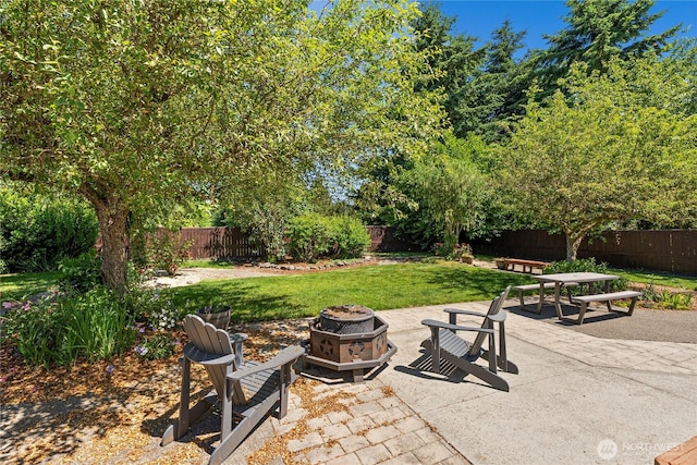 4404 29th Ave SE, Lacey, WA 98503 - fenced backyard featuring an outdoor fire pit and a patio