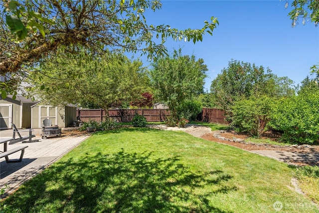 4404 29th Ave SE, Lacey, WA 98503 - fenced backyard with a storage unit and a patio