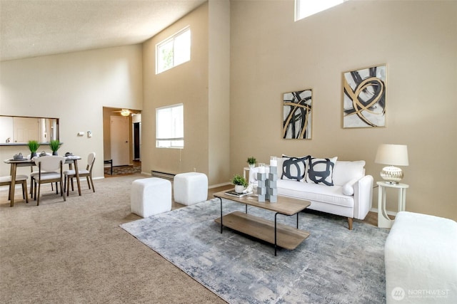 13714 SE 258th Pl Unit 36, Kent, WA 98042 - carpeted living area with a towering ceiling, a baseboard heating unit, and baseboards