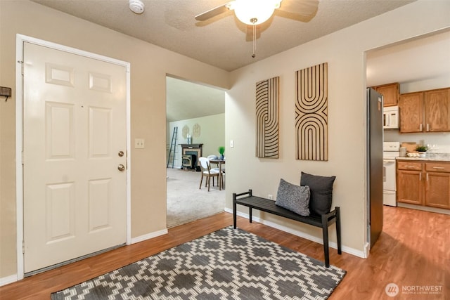 13714 SE 258th Pl Unit 36, Kent, WA 98042 - entrance foyer featuring light wood-style flooring, ceiling fan, and baseboards