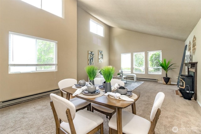 13714 SE 258th Pl Unit 36, Kent, WA 98042 - dining room featuring carpet flooring, high vaulted ceiling, a wood stove, and a baseboard heating unit