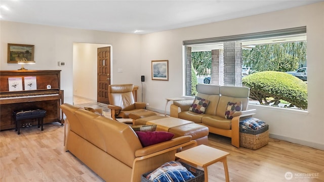 1525 E Catalpa St, Othello, WA 99344 - living area with plenty of natural light, light wood-style flooring, and baseboards
