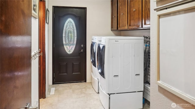 1525 E Catalpa St, Othello, WA 99344 - laundry room featuring washing machine and clothes dryer and cabinet space