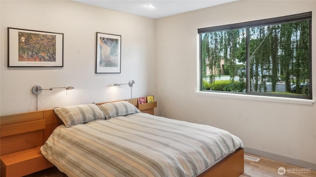 1525 E Catalpa St, Othello, WA 99344 - bedroom with wood finished floors and baseboards