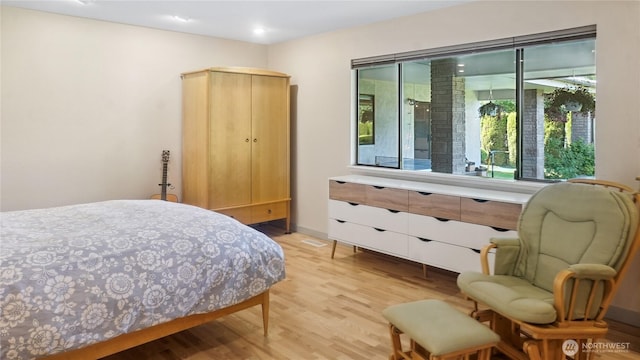 1525 E Catalpa St, Othello, WA 99344 - bedroom with light wood-style floors, baseboards, and recessed lighting