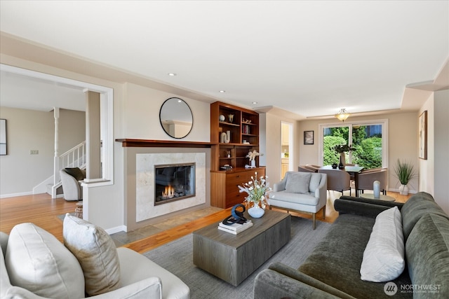 22035 99th Pl W, Edmonds, WA 98020 - living area featuring wood finished floors, a fireplace, baseboards, stairs, and recessed lighting