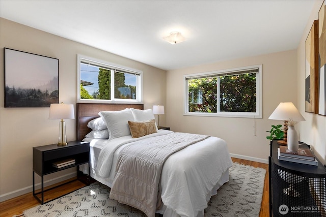 22035 99th Pl W, Edmonds, WA 98020 - bedroom featuring baseboards and wood finished floors