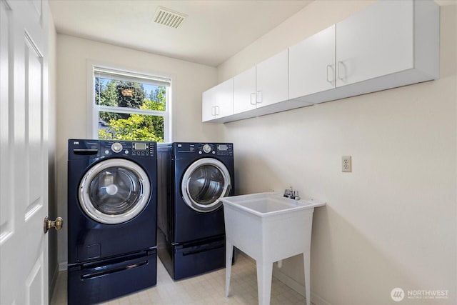 22035 99th Pl W, Edmonds, WA 98020 - laundry room with washing machine and dryer, cabinet space, and baseboards