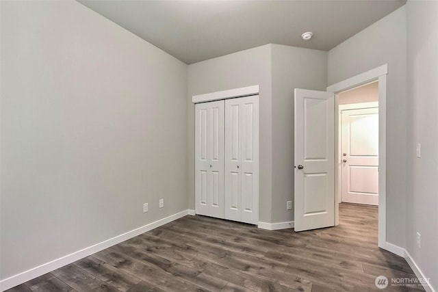 3007 Fiddleback St NE, Lacey, WA 98516 - unfurnished bedroom featuring dark wood-type flooring and a closet
