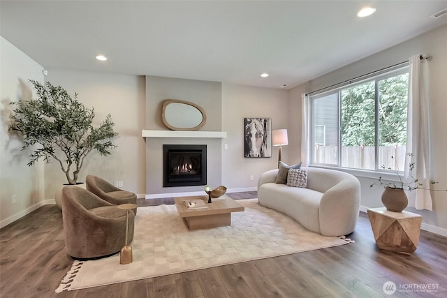 3007 Fiddleback St NE, Lacey, WA 98516 - living area featuring wood finished floors, recessed lighting, and a warm lit fireplace