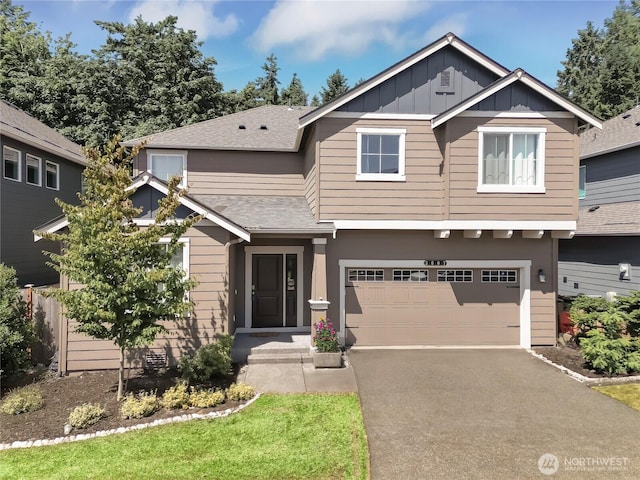 3007 Fiddleback St NE, Lacey, WA 98516 - view of front of house with an attached garage, roof with shingles, driveway, and board and batten siding