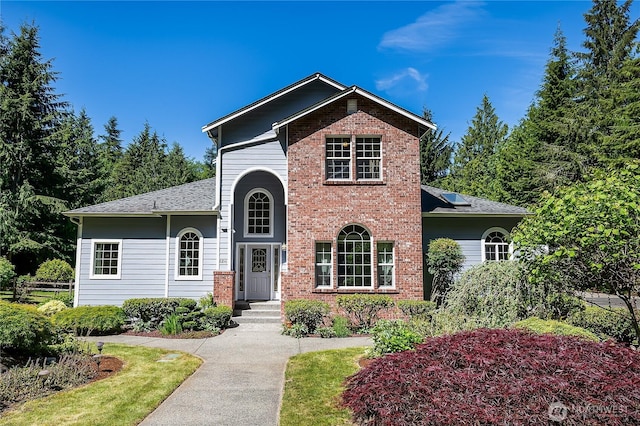 6841 NW Ranger Way, Silverdale, WA 98383 - traditional-style home with roof with shingles and brick siding