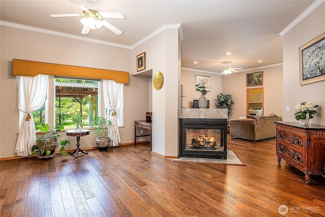 6841 NW Ranger Way, Silverdale, WA 98383 - living room featuring ceiling fan, crown molding, wood finished floors, recessed lighting, and a multi sided fireplace
