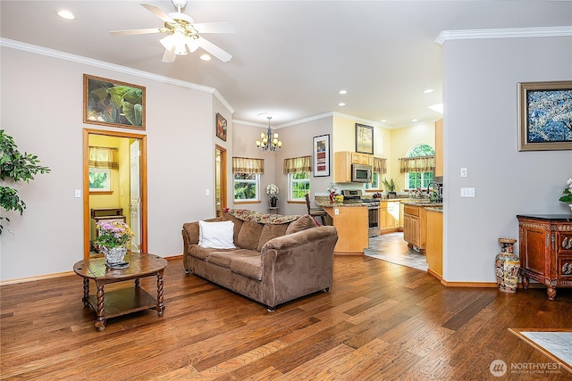 6841 NW Ranger Way, Silverdale, WA 98383 - living area with wood finished floors, a chandelier, recessed lighting, ceiling fan, and ornamental molding